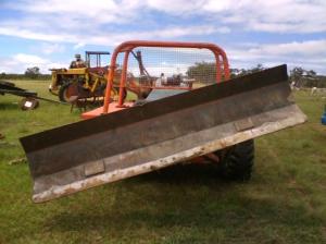 Here it is stripped down with just the blade attached, tilted so great for drains, road works, etc. 